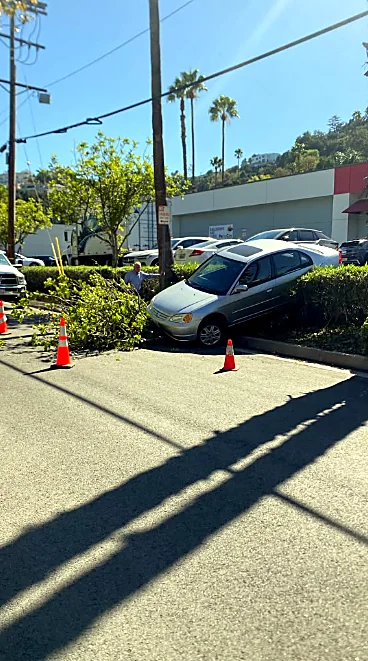 Parking-lot recovery: Pulled back off a planter, no extra damage